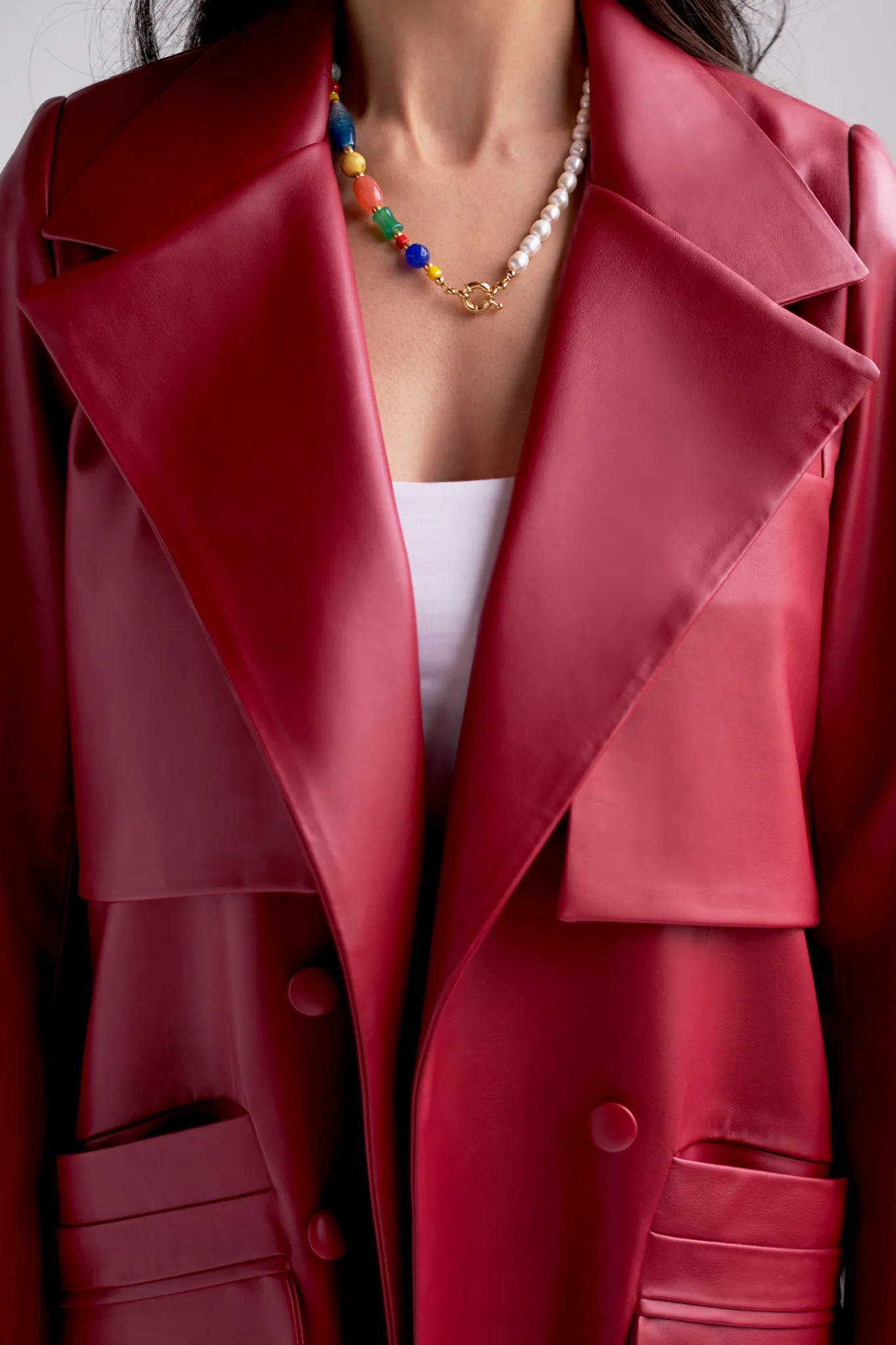 Belted vegan leather trench coat in red